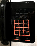 Microwave buttons outlined in Orange tactile paint.