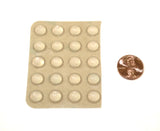 Sheet of 20 medium sized, clear, round, dome shaped bump dots next to a penny. The individual bump dots are 1/4 size of a penny.